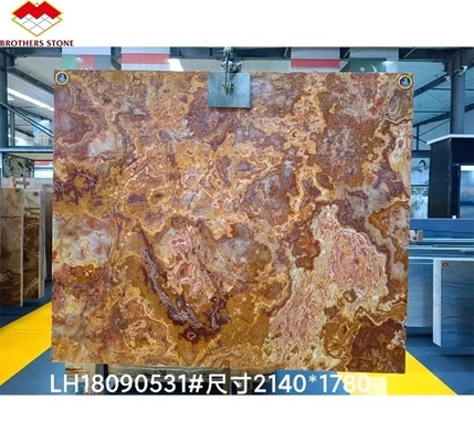 Marbre en onyx rouge tigre naturel polissé translucide pour le design d'hôtel en jade moderne rétroéclairé