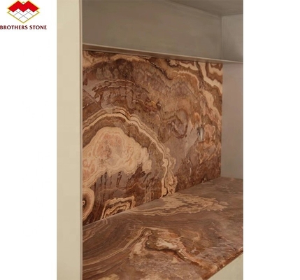 Marbre en onyx rouge tigre naturel polissé translucide pour le design d'hôtel en jade moderne rétroéclairé