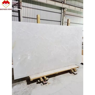 Plaque de marbre en onyx translucide naturel de l'ère glaciaire pour panneaux muraux rétroéclairés Tableau dans les hôtels