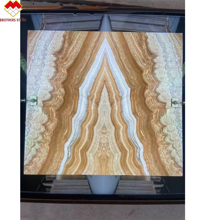 Style de conception moderne rétroéclairé en jaune Onyx Livre correspondant à la dalle d'onyx tigre naturel moderne